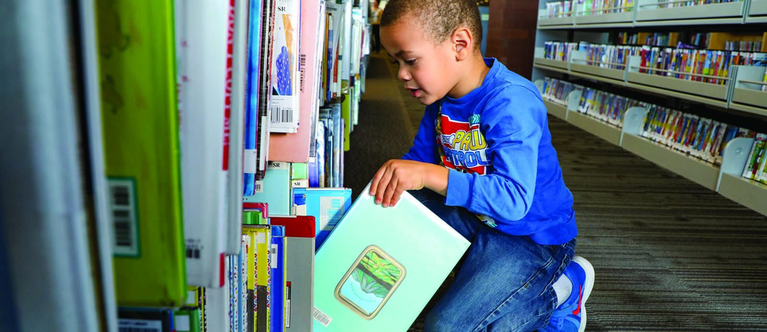 kid at library