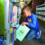 kid at library