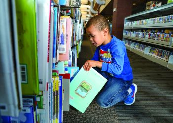 kid at library