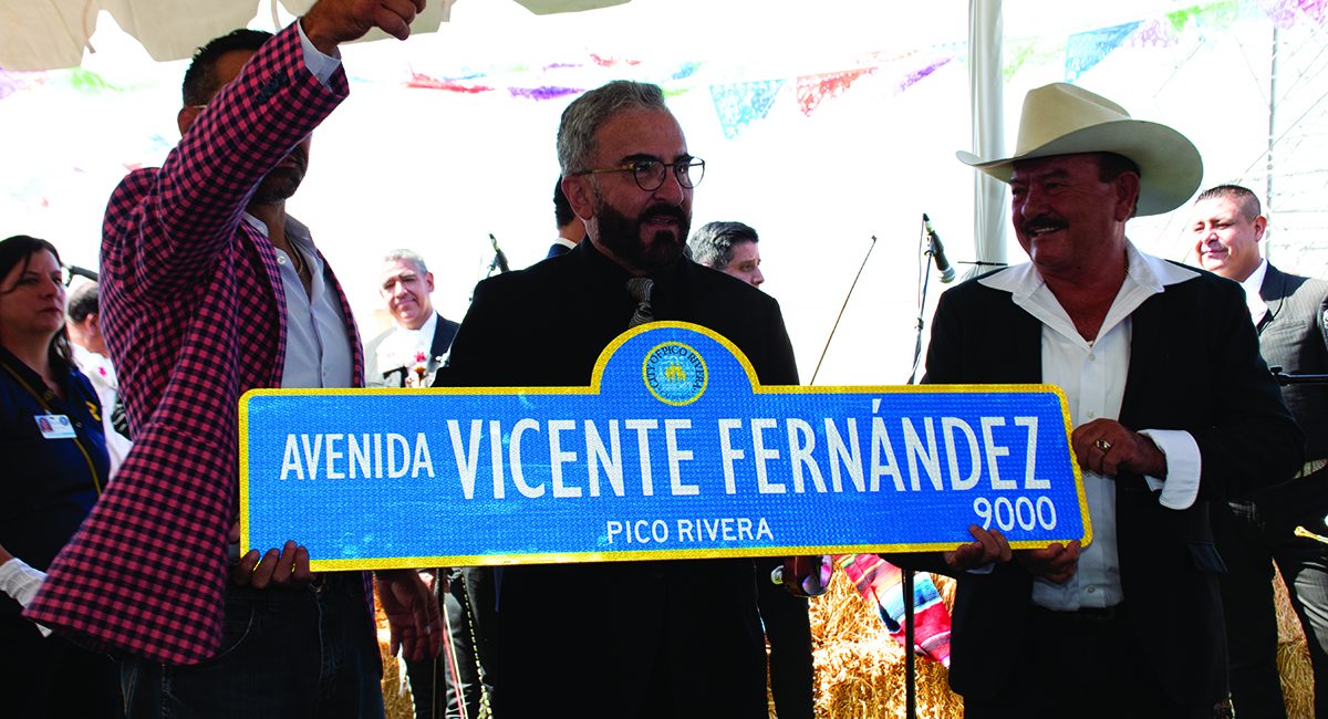 Vicente Jr. holding sign