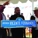 Vicente Jr. holding sign