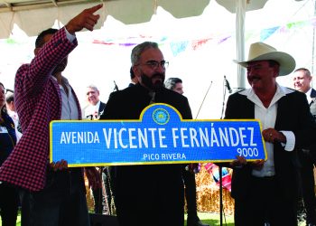 Vicente Jr. holding sign