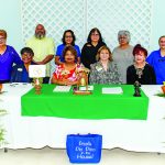 Womans Club behind desk