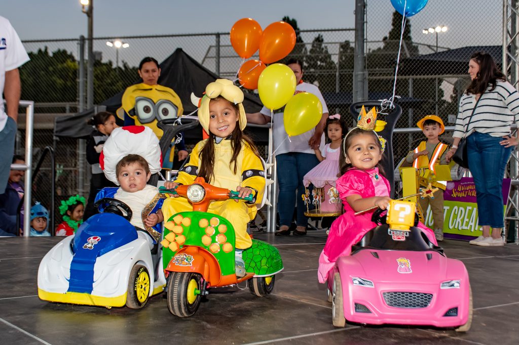 A group of kids in Super Mario costumes at Halloween Spooktacular